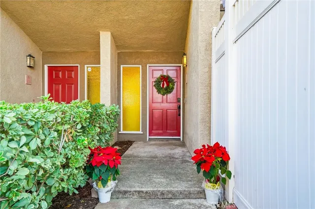 a view of a house with a flower garden