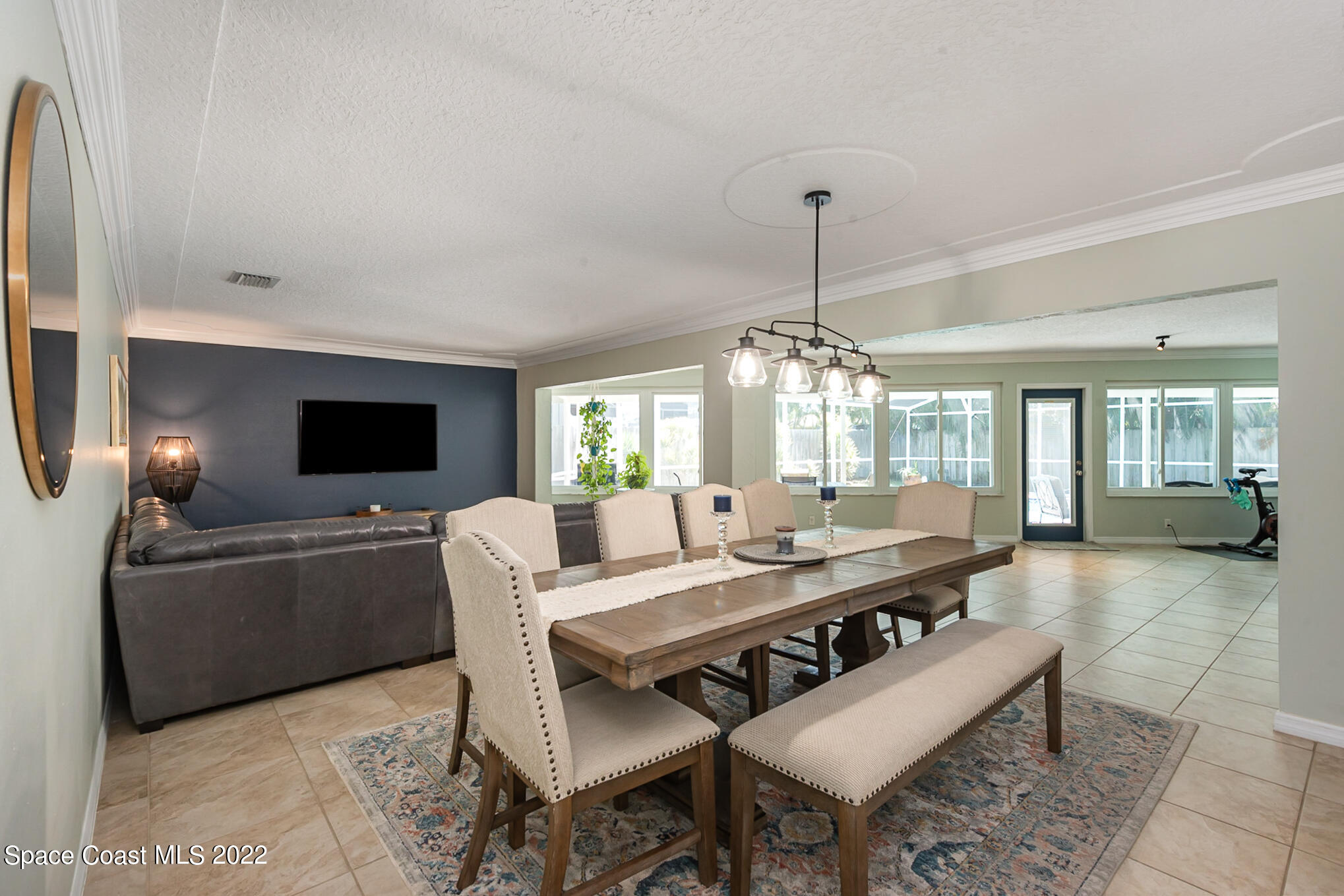 395 Rio Lane Indialantic, FL 32903 - Photo 13 of 40 a living room with furniture a window and a flat screen tv