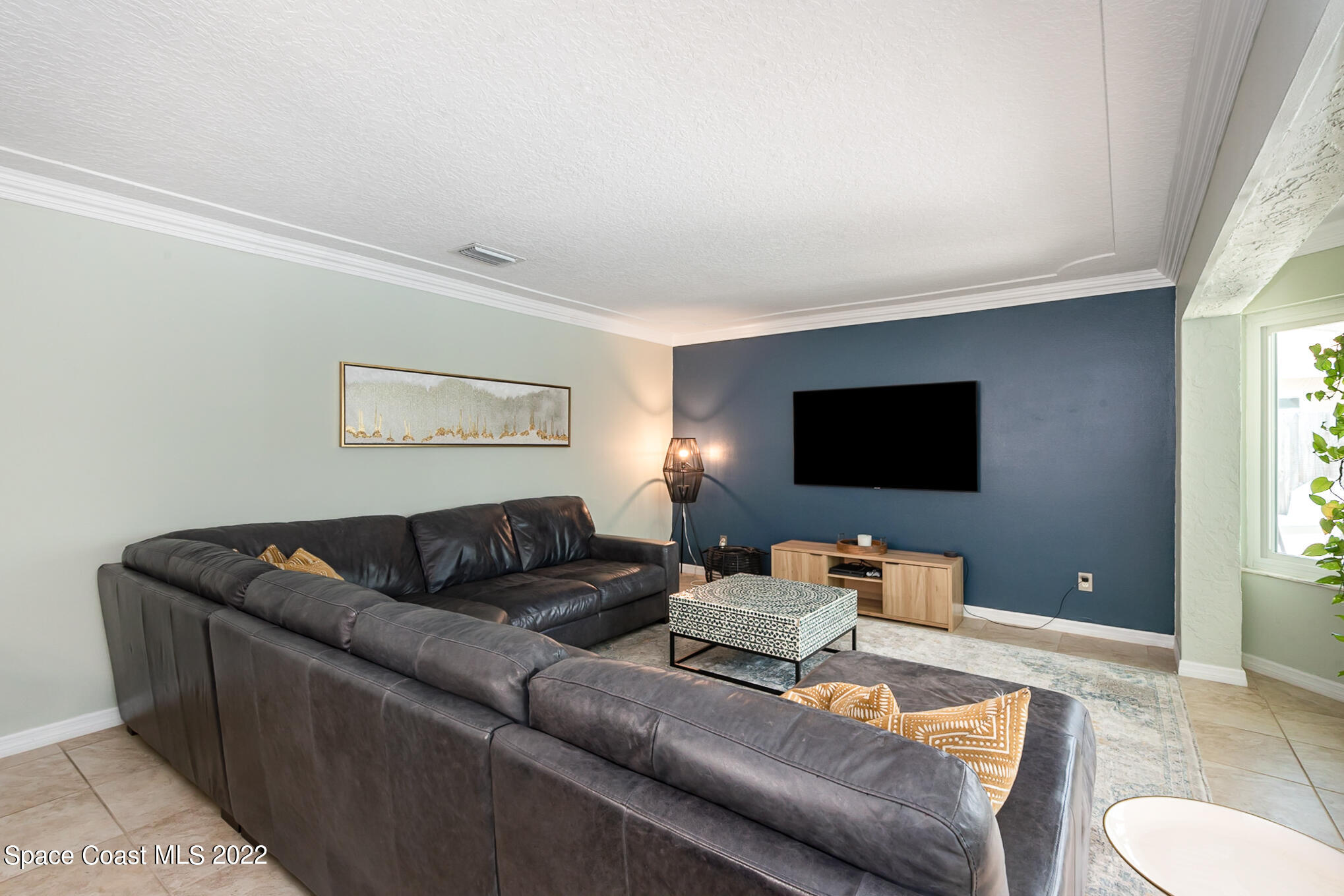 395 Rio Lane Indialantic, FL 32903 - Photo 14 of 40 a living room with furniture and a flat screen tv
