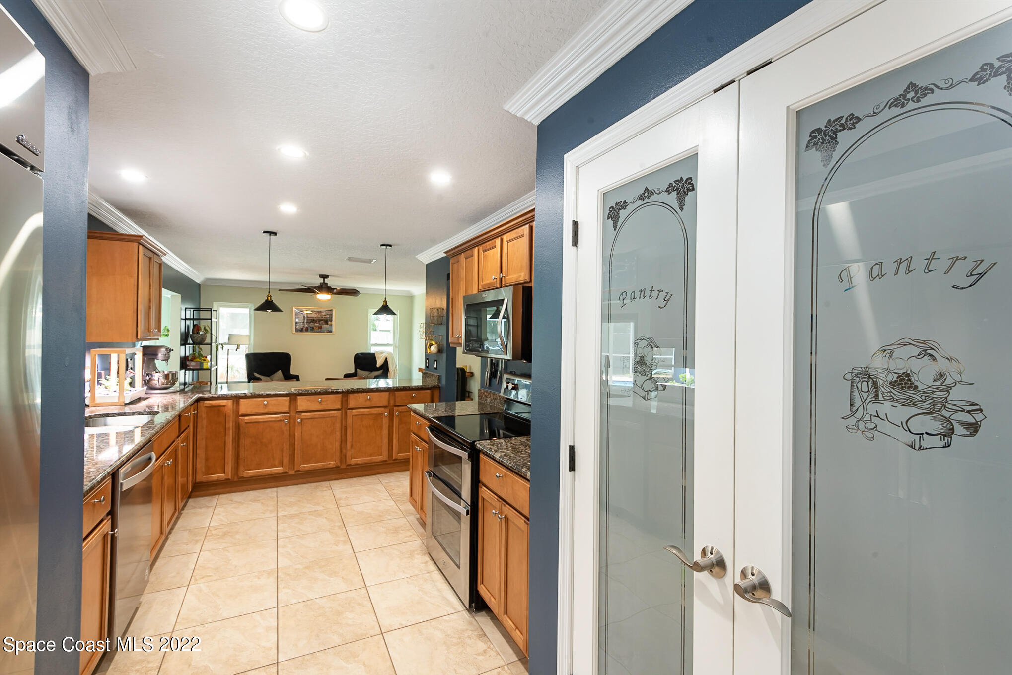 395 Rio Lane Indialantic, FL 32903 - Photo 17 of 40 a large white kitchen with a large window