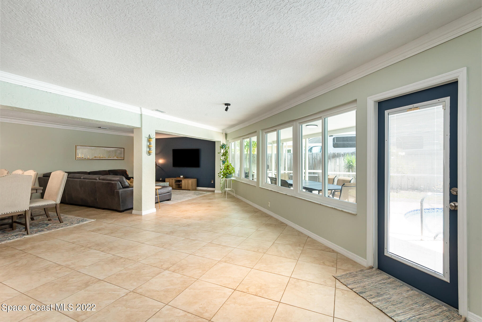 395 Rio Lane Indialantic, FL 32903 - Photo 21 of 40 a room with furniture and a large window