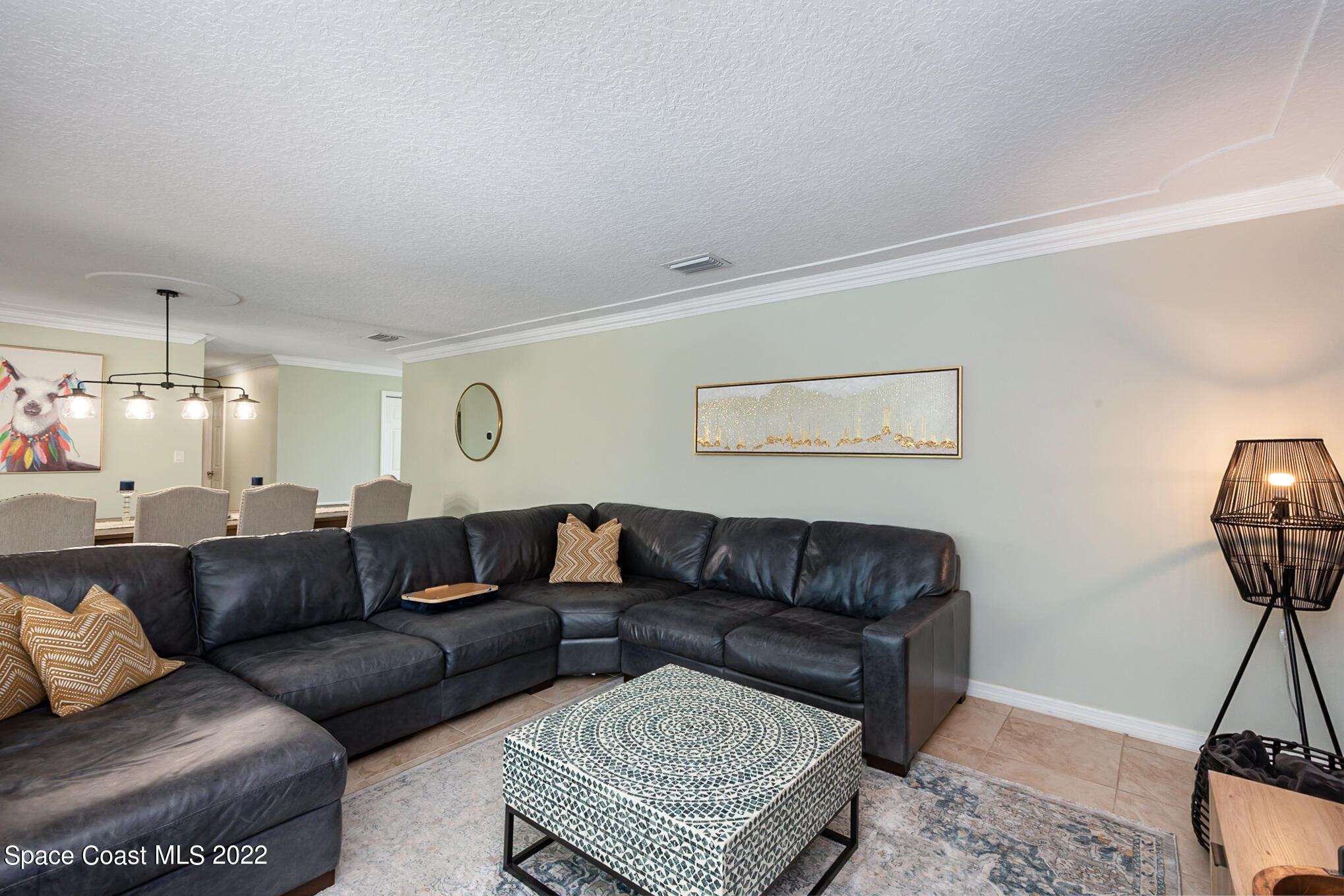 395 Rio Lane Indialantic, FL 32903 - Photo 24 of 40 a living room with furniture and a chandelier