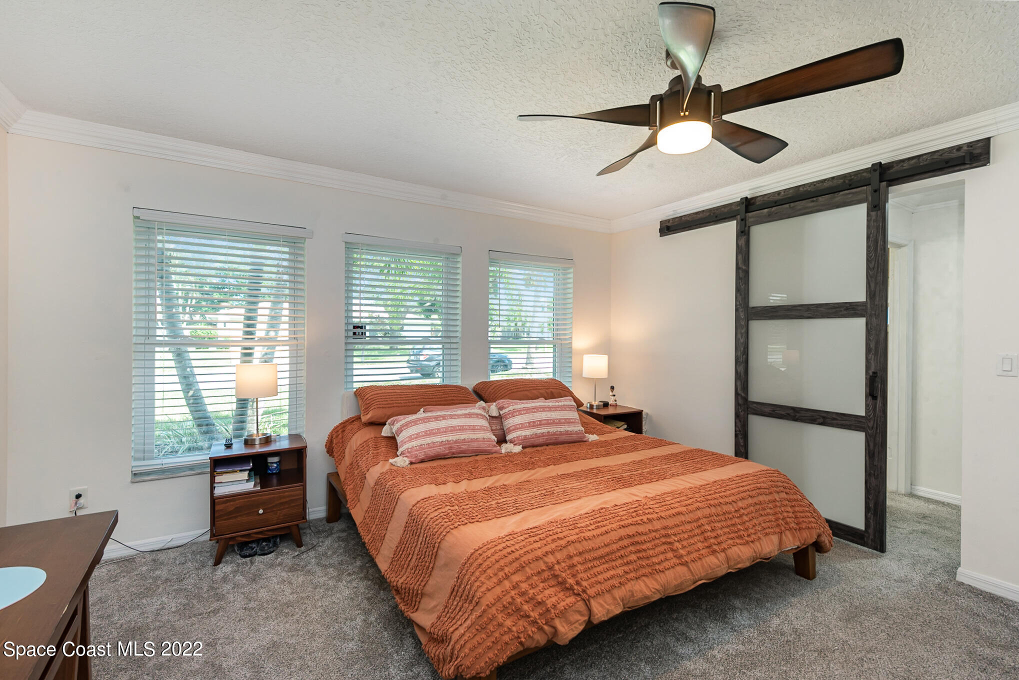395 Rio Lane Indialantic, FL 32903 - Photo 26 of 40 a bedroom with a bed and a window