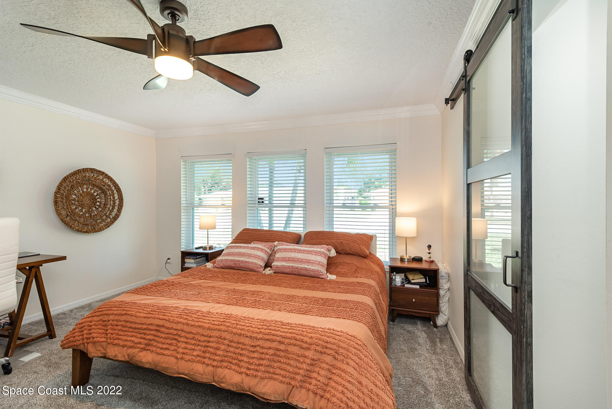 395 Rio Lane Indialantic, FL 32903 - Photo 27 of 40 a bedroom with a bed and a window