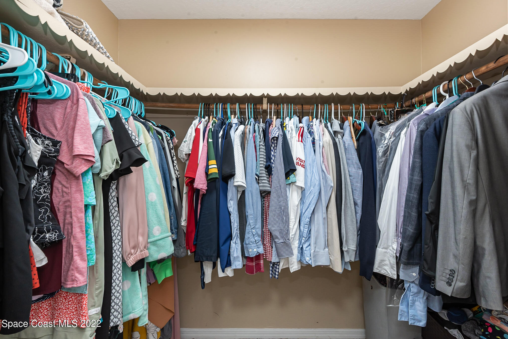 395 Rio Lane Indialantic, FL 32903 - Photo 30 of 40 a view of walk in closet with clothes and shoes