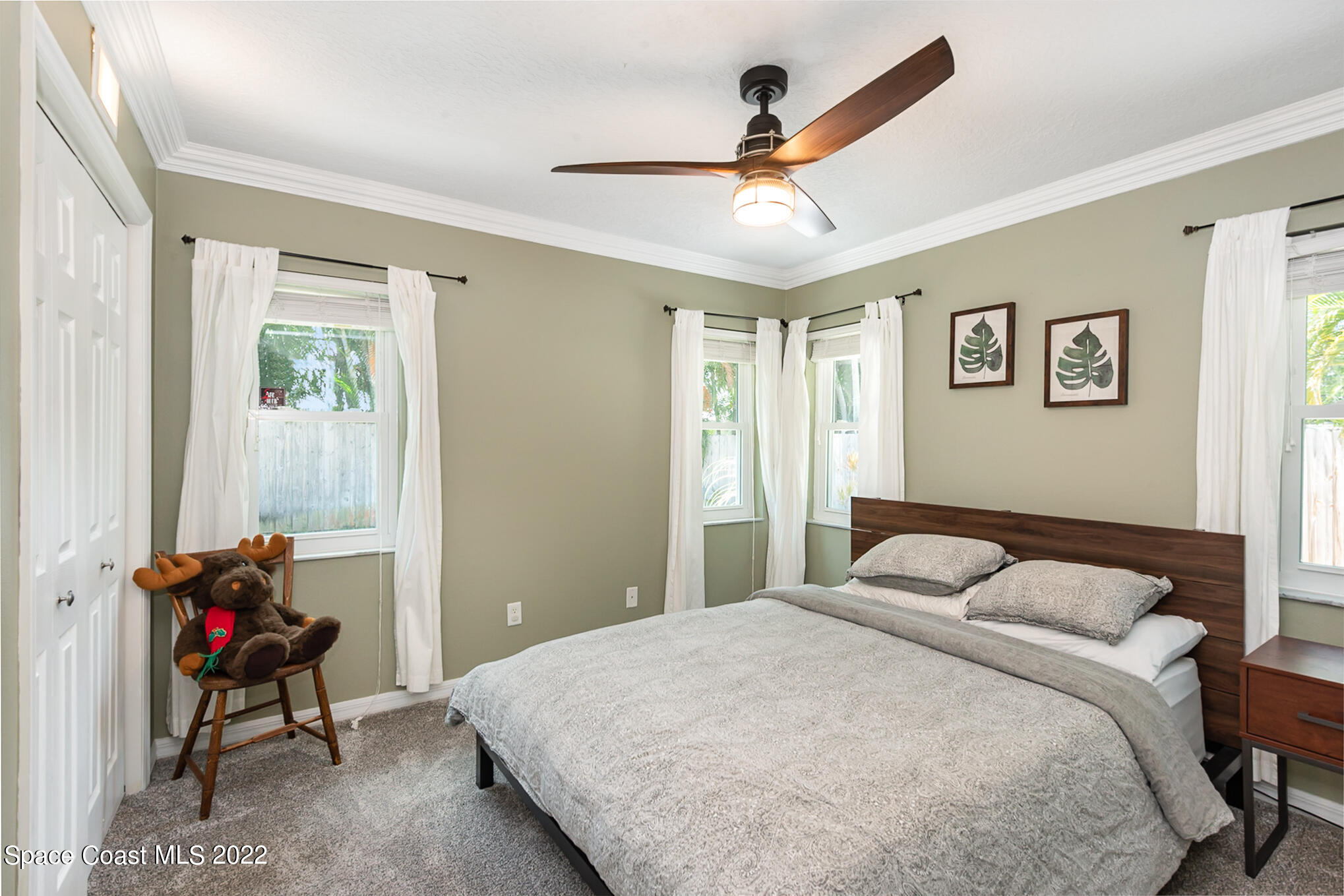 395 Rio Lane Indialantic, FL 32903 - Photo 32 of 40 a bedroom with a bed and a window