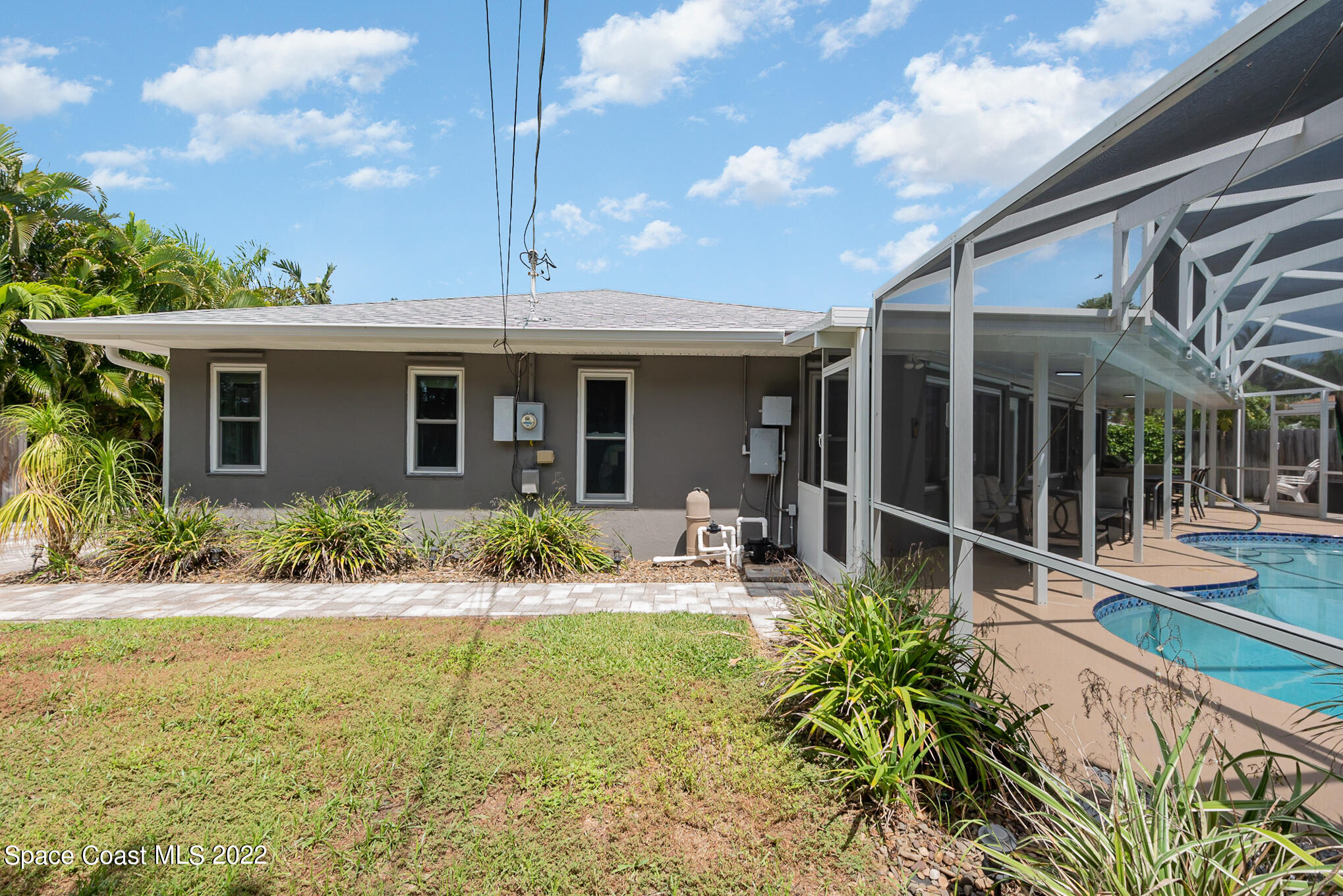 395 Rio Lane Indialantic, FL 32903 - Photo 38 of 40 a front view of house with yard and outdoor seating