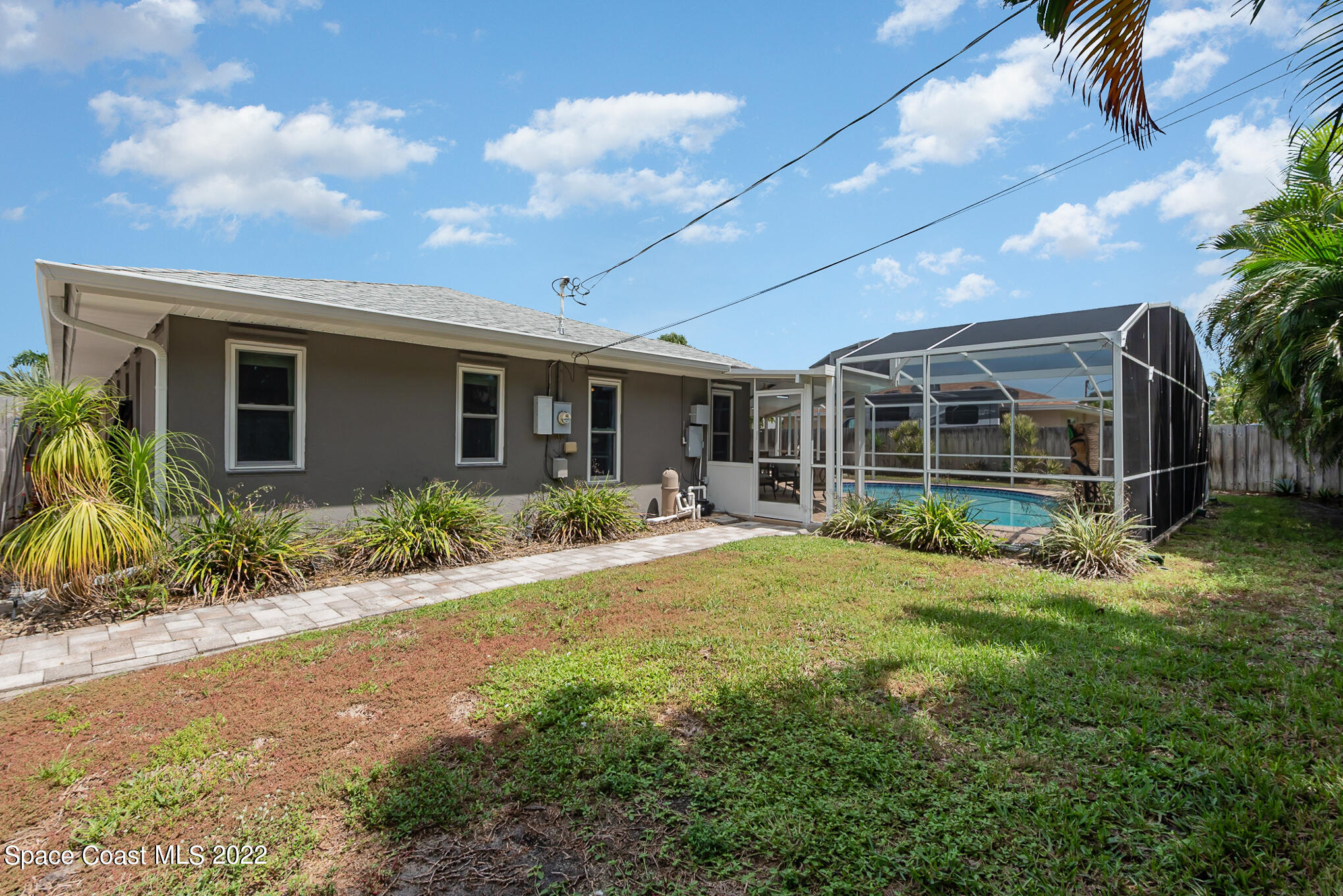 395 Rio Lane Indialantic, FL 32903 - Photo 39 of 40 a front view of house with yard and green space