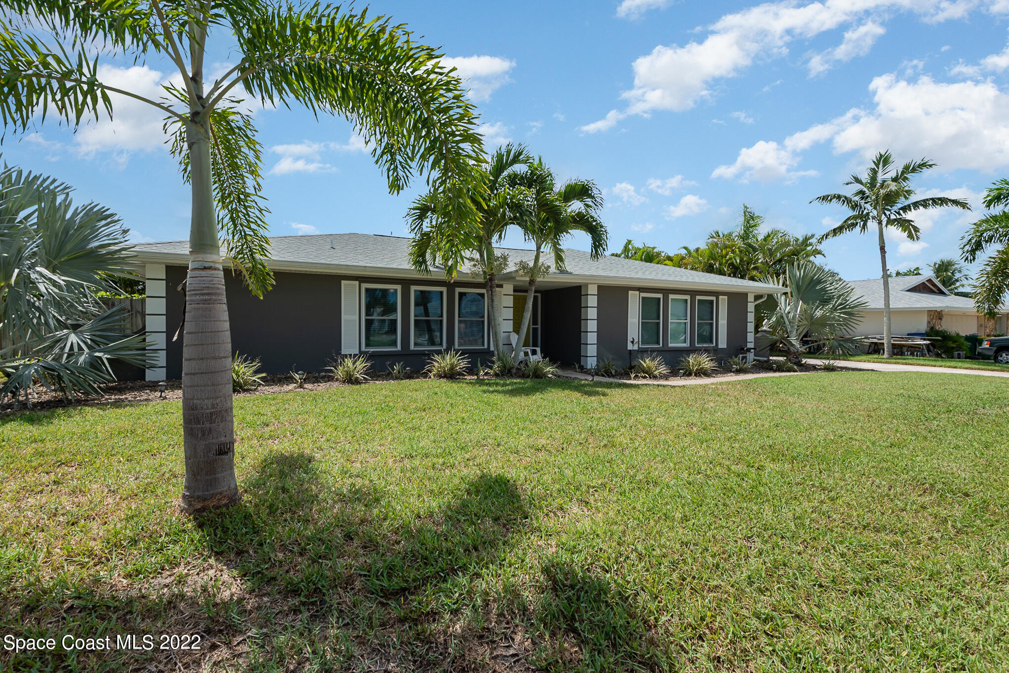 395 Rio Lane Indialantic, FL 32903 - Photo 4 of 40 a front view of house with yard and green space