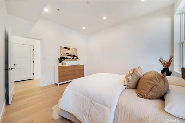 a bedroom with a bed and a cabinets