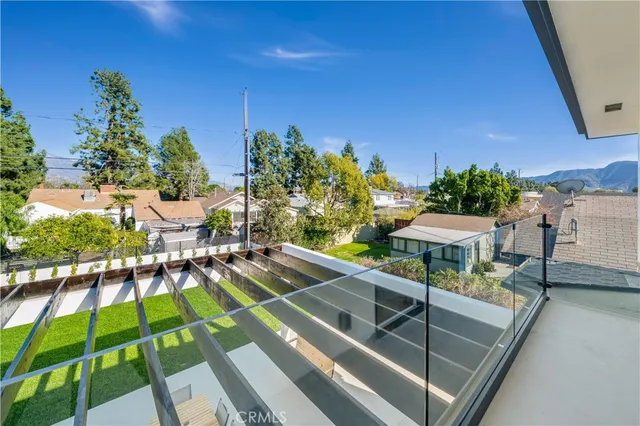 a view of a swimming pool with a patio and a garden