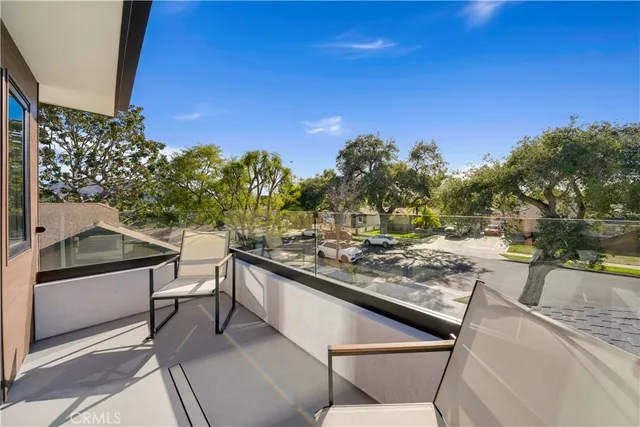 a view of a chairs and table in the patio