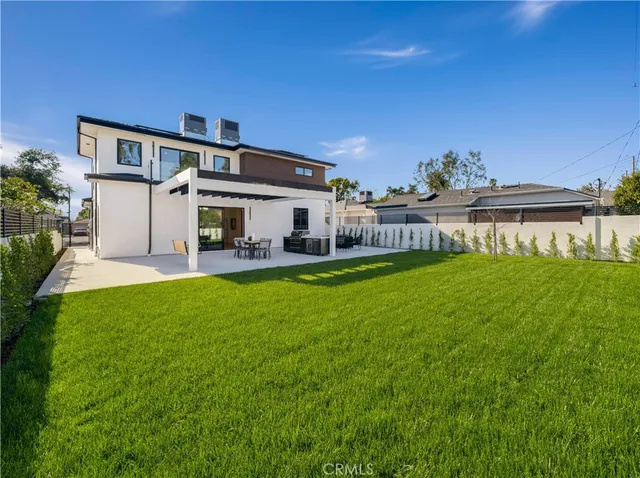 a view of a house with a yard porch and sitting area
