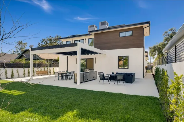 a view of a house with a yard porch and sitting area