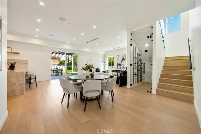 a dining room with furniture and wooden floor