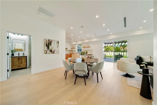 a dining room with furniture and a window