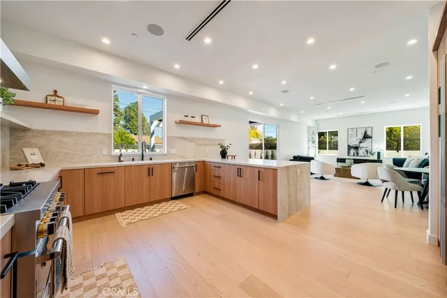 a large room with lots of counter space and a wooden floor