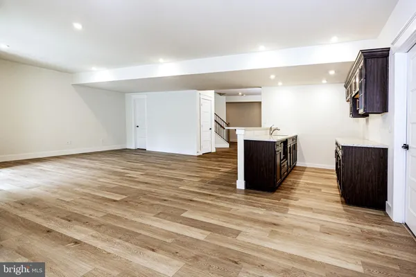 a view of empty room with wooden walls