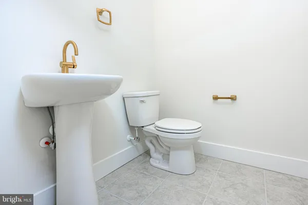 a view of walk in closet with clothes