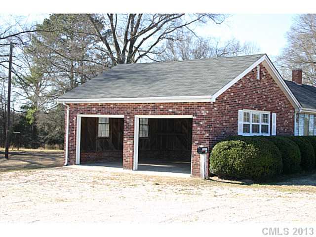 3396 Flat Creek Road Lancaster, SC 29720 - Photo 2 of 10 a front view of a house with a yard