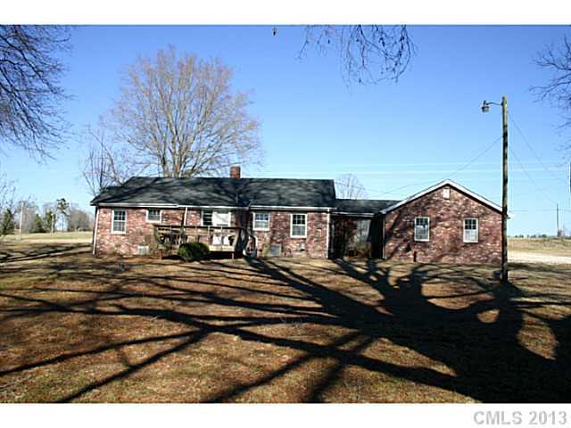 3396 Flat Creek Road Lancaster, SC 29720 - Photo 3 of 10 a view of a house with a wooden deck and a forest