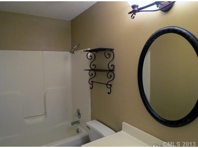 1015 Piney Church Road Concord, NC 28025 - Photo 13 of 13 a bathroom with a bathtub and a shower