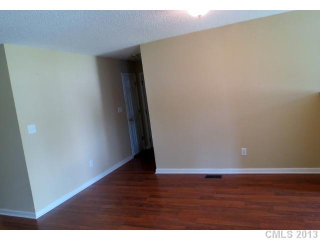 1015 Piney Church Road Concord, NC 28025 - Photo 8 of 13 a view of an empty room with wooden floor