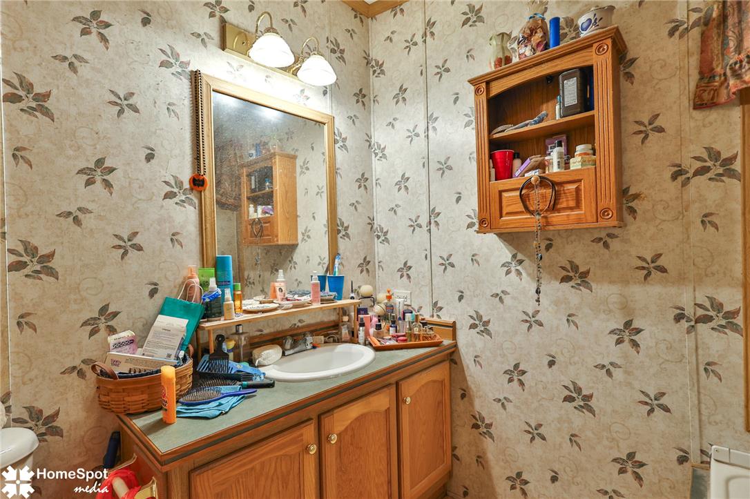 3795 Rhoades Road Kempton, PA 19529 - Photo 10 of 42 A well-lit vanity with ample counter space and storage in a functional bathroom.