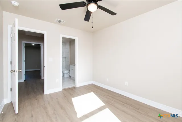 a view of an empty room and window