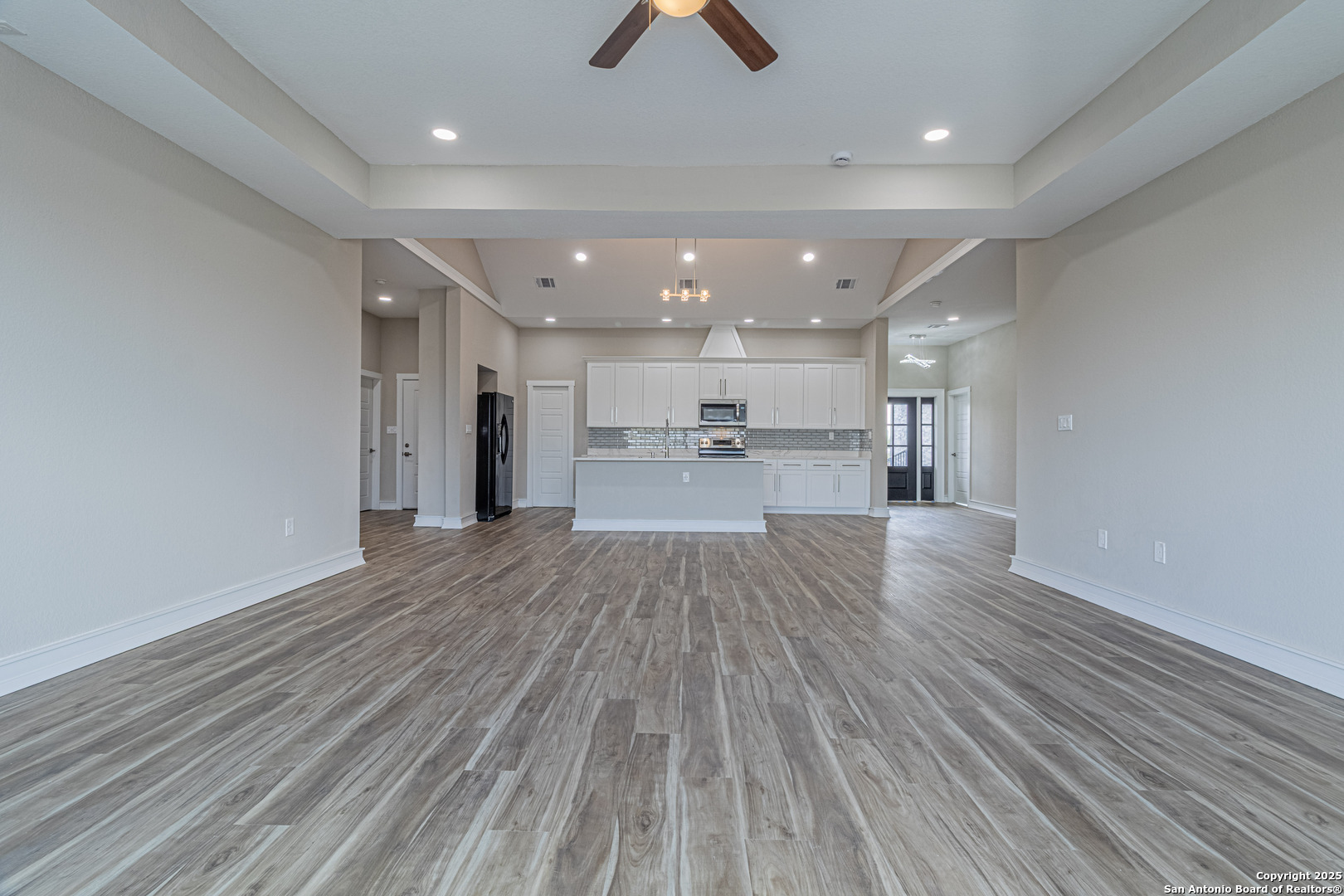 16923 Rancho Escondido Atascosa, TX 78002 - Photo 13 of 35 a view of kitchen and wooden floor