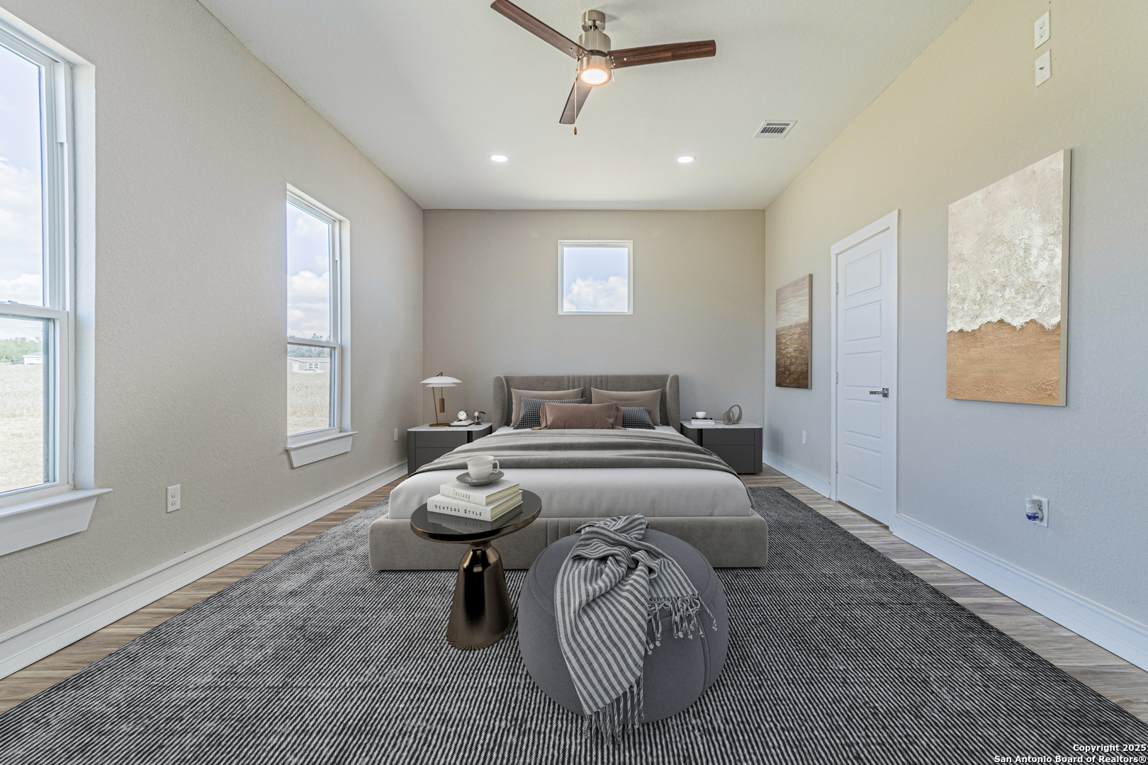 16923 Rancho Escondido Atascosa, TX 78002 - Photo 16 of 35 a spacious bedroom with a bed and a window