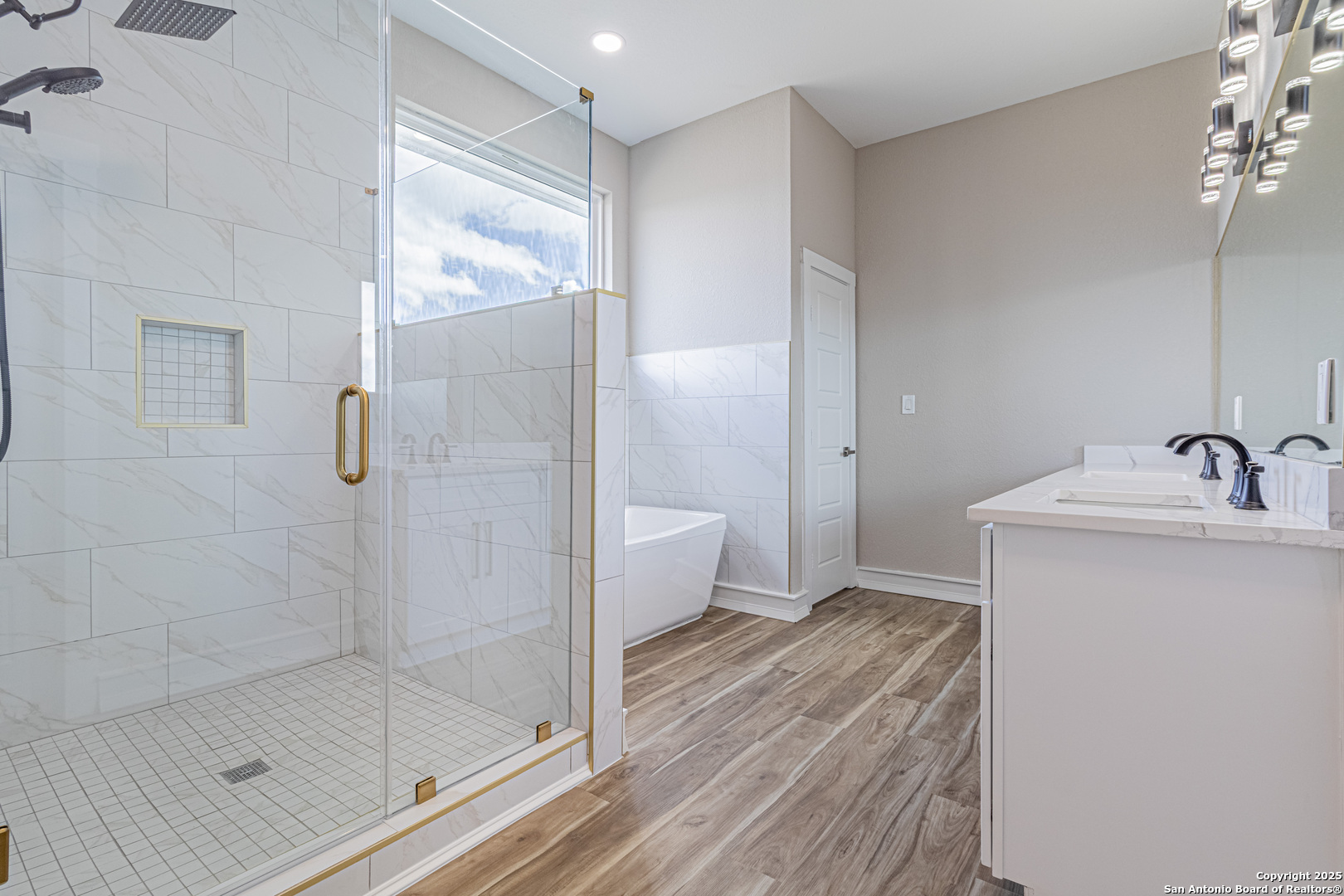 16923 Rancho Escondido Atascosa, TX 78002 - Photo 17 of 35 a bathroom with a bathtub shower sink and toilet