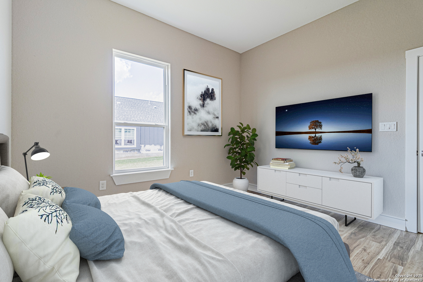 16923 Rancho Escondido Atascosa, TX 78002 - Photo 23 of 35 a bedroom with a bed and a flat screen tv