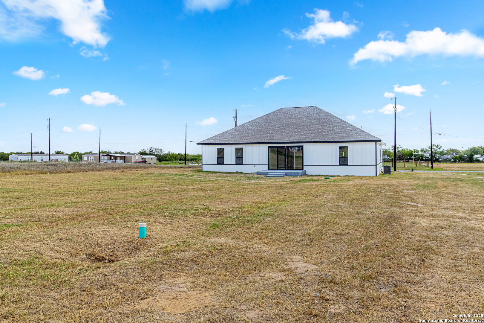 16923 Rancho Escondido Atascosa, TX 78002 - Photo 31 of 35 a house with pool in front of it