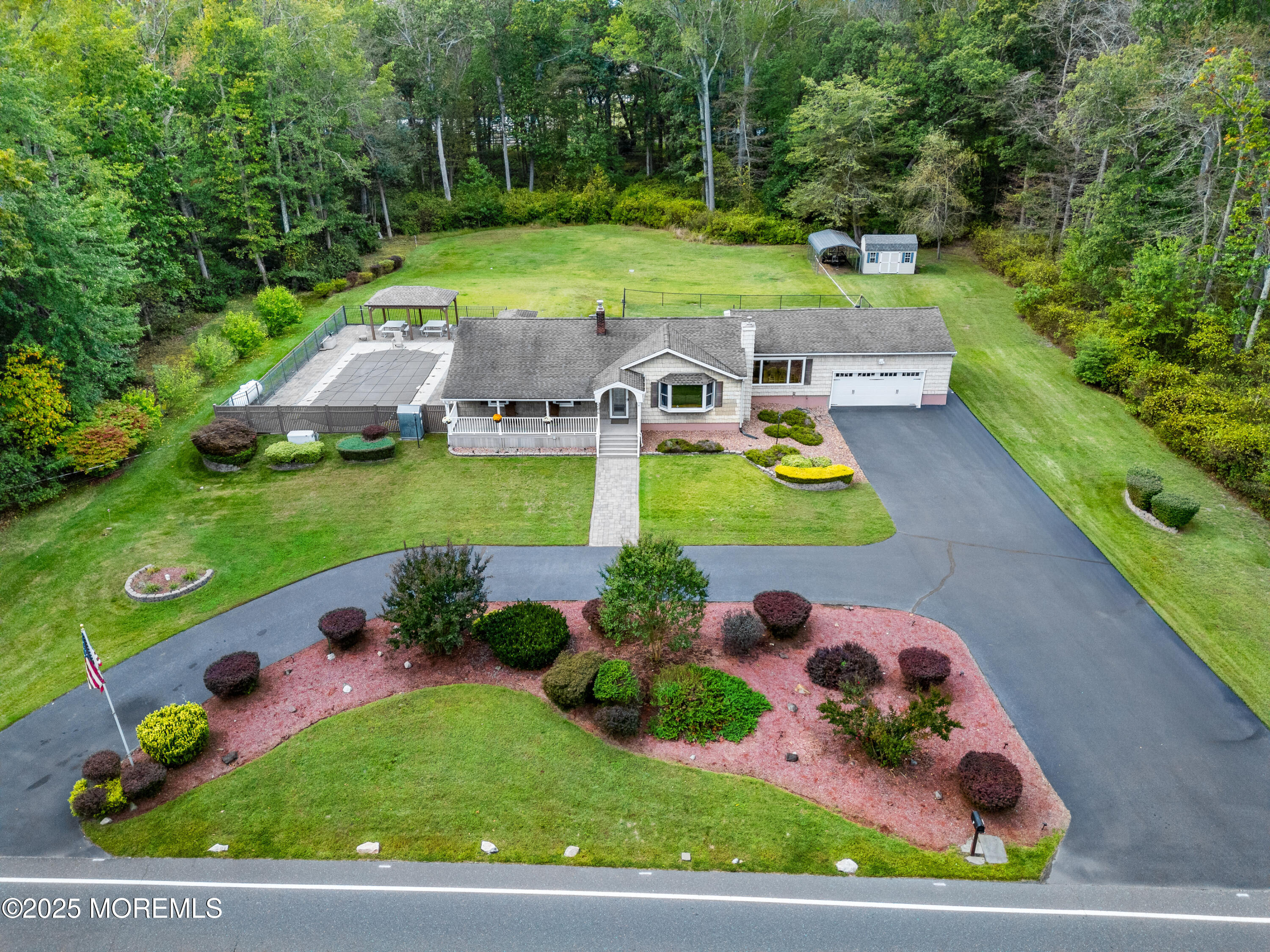 284 Jackson Mills Road Freehold, NJ 07728 - Photo 1 of 34 a view of yard with swimming pool and outdoor seating