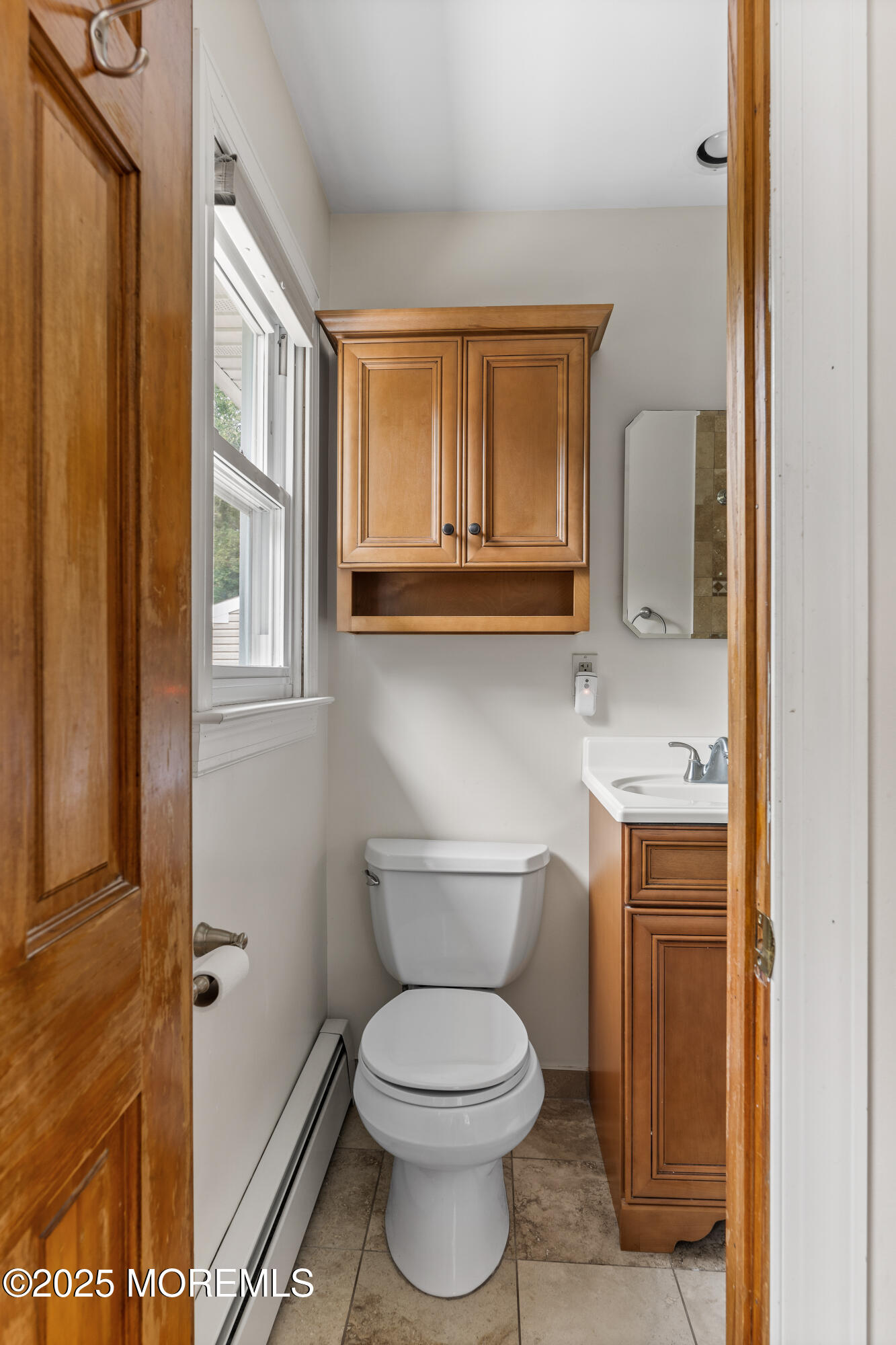 284 Jackson Mills Road Freehold, NJ 07728 - Photo 20 of 34 a bathroom with a toilet sink and mirror