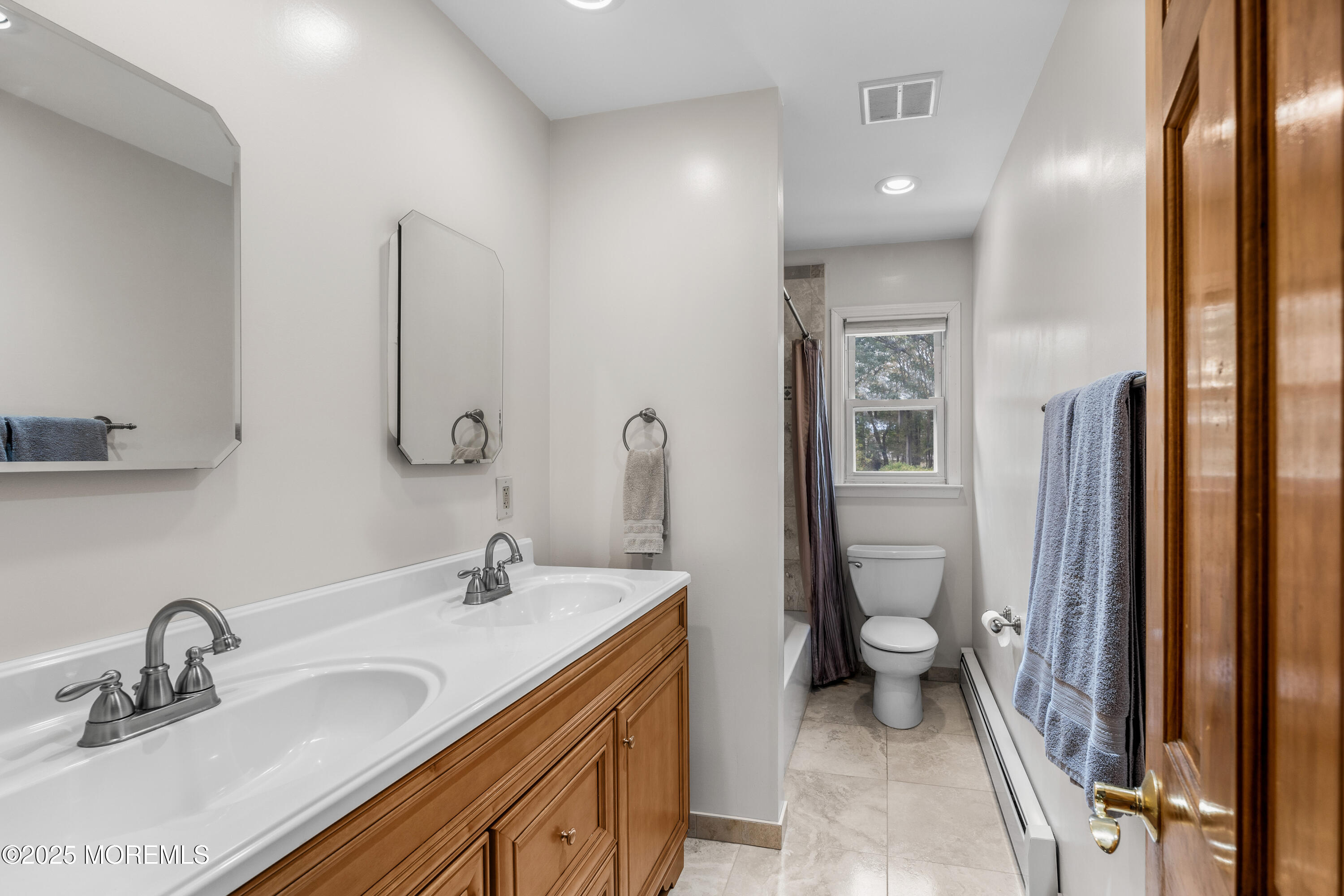 284 Jackson Mills Road Freehold, NJ 07728 - Photo 24 of 34 a bathroom with a sink toilet and shower
