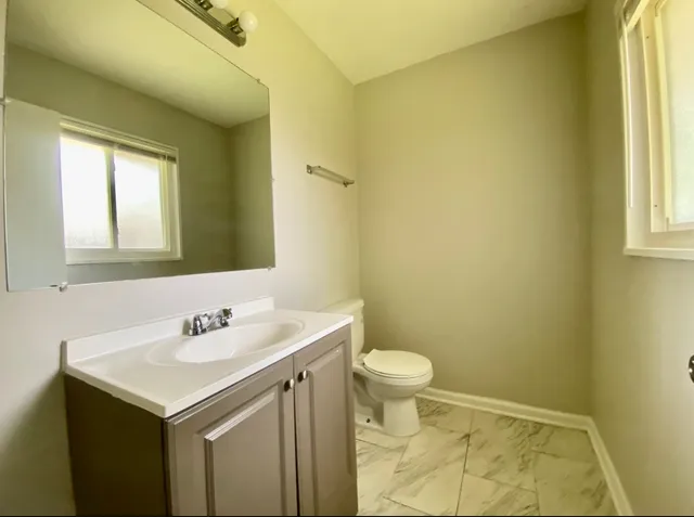 a bathroom with a sink and a vanity