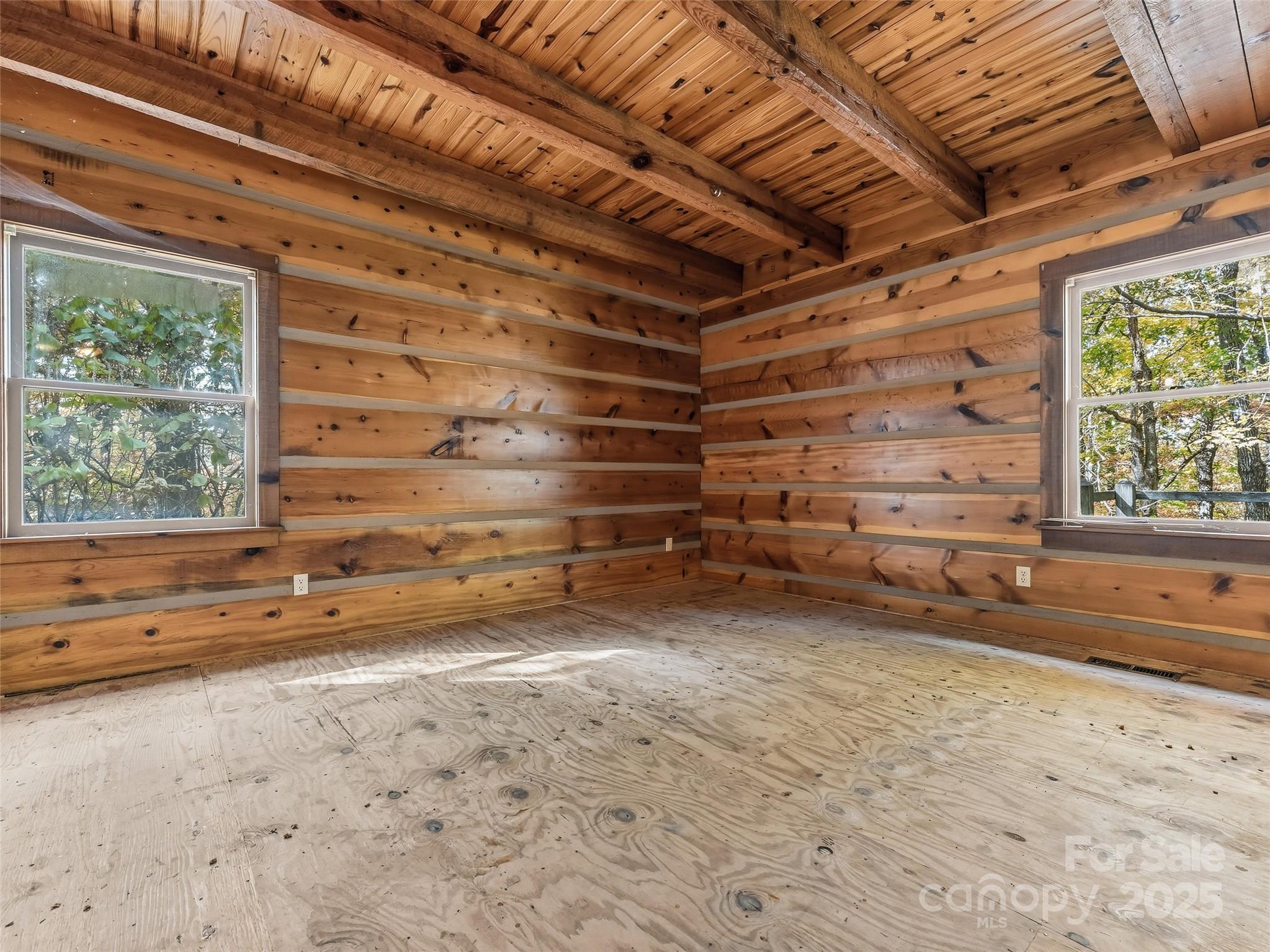 6130 Howard Gap Road Saluda, NC 28773 - Photo 15 of 27 a view of a room with wooden walls and stairs