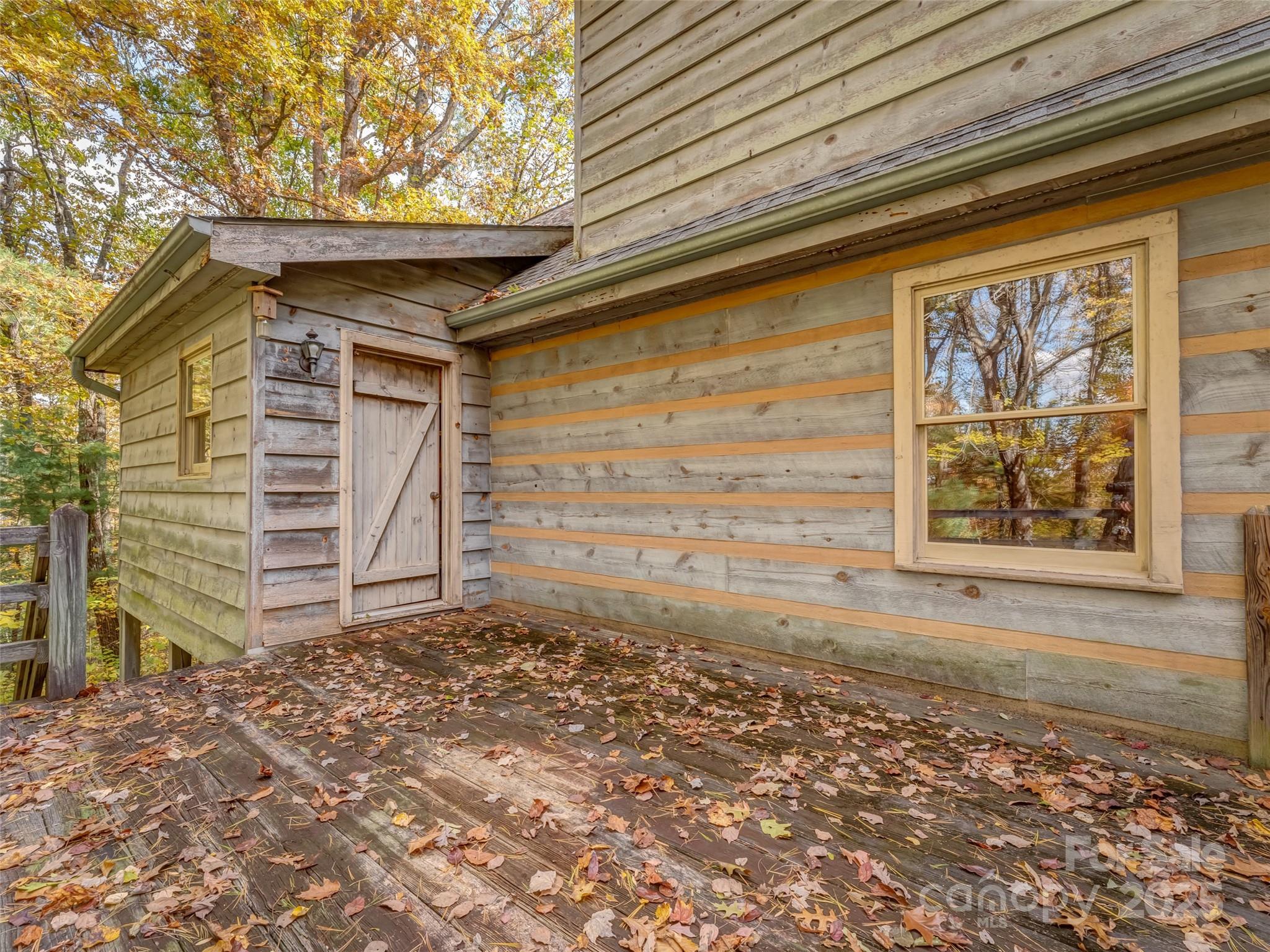 6130 Howard Gap Road Saluda, NC 28773 - Photo 19 of 27 a front view of a house with a large window