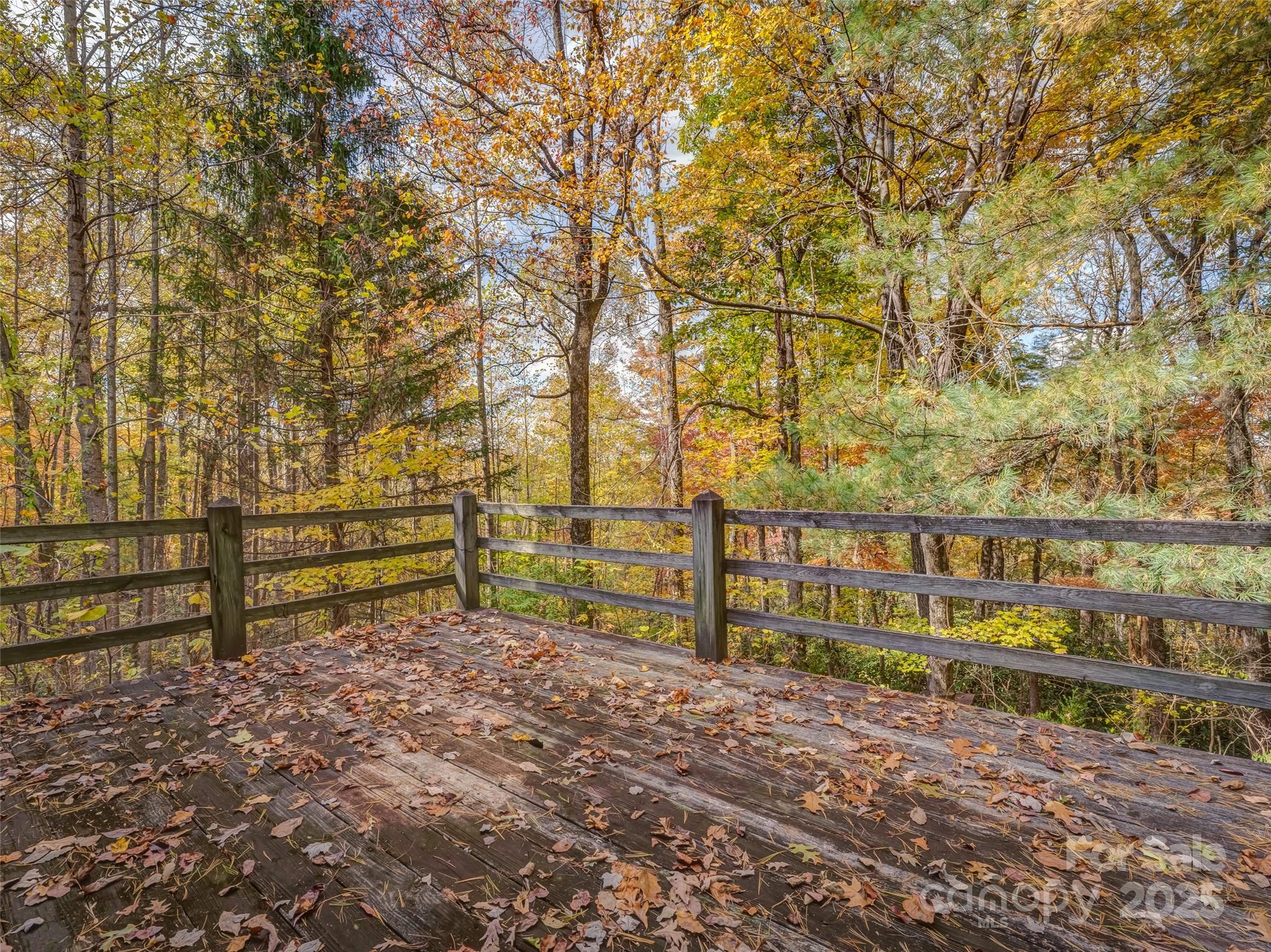6130 Howard Gap Road Saluda, NC 28773 - Photo 20 of 27 a view of street with wooden fence