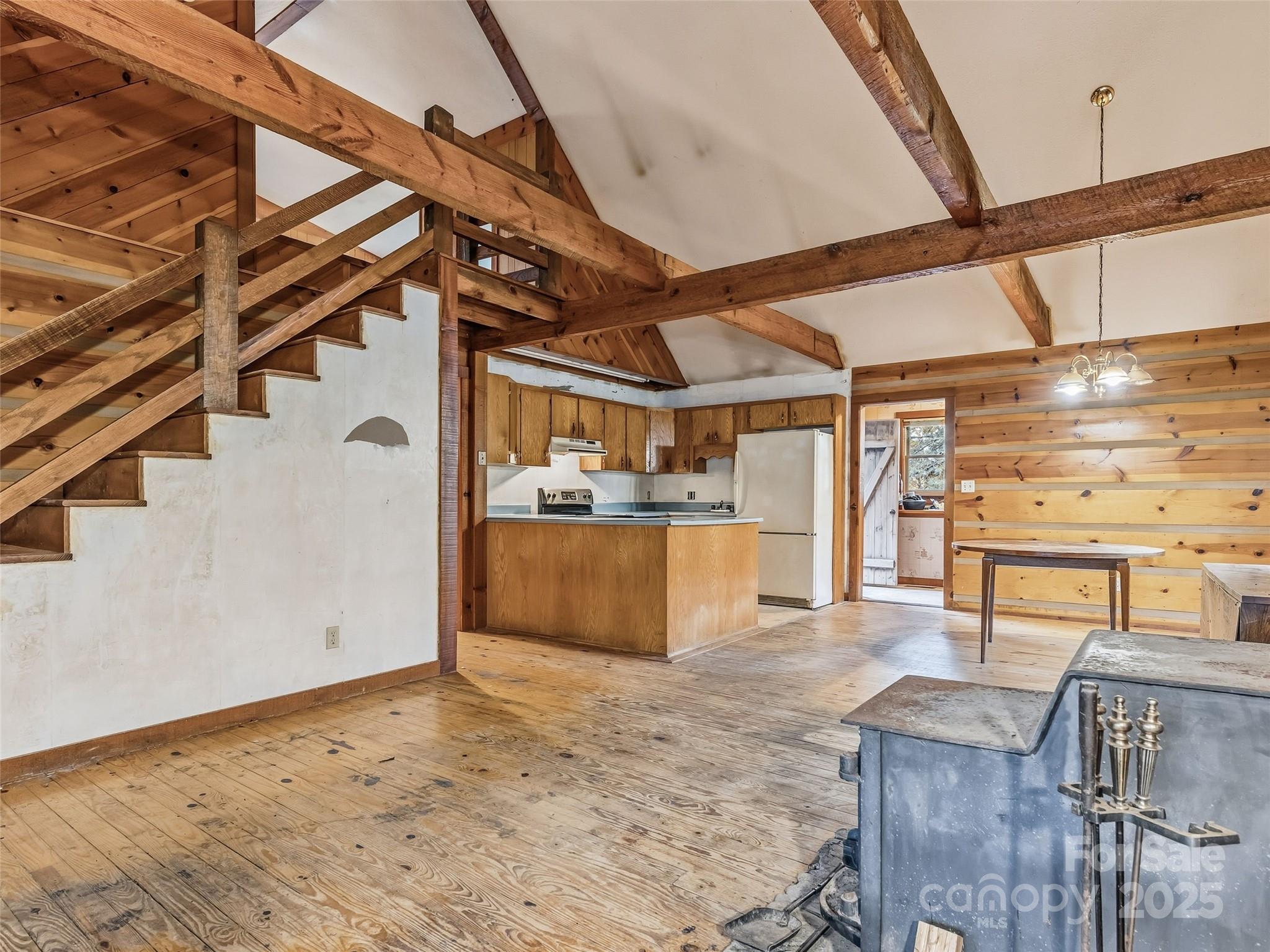 6130 Howard Gap Road Saluda, NC 28773 - Photo 5 of 27 a view of a room with racks on the kitchen