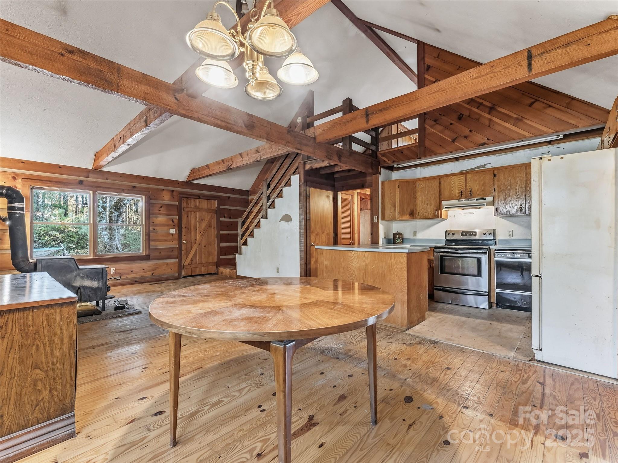 6130 Howard Gap Road Saluda, NC 28773 - Photo 8 of 27 a view of a dining room with furniture window and outside view
