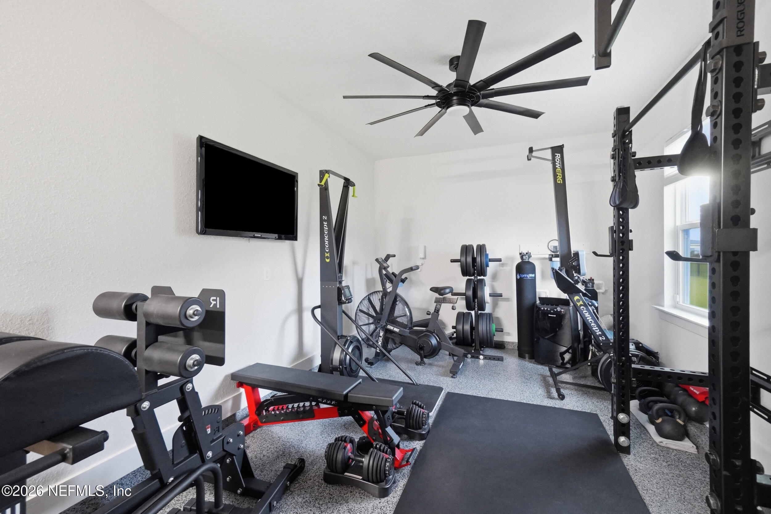 34 Red Rock Lane St. Johns, FL 32259 - Photo 45 of 71 a room with gym equipment and a flat screen tv