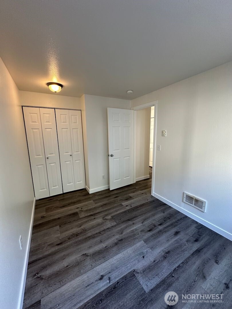 2515 Melvin Avenue, Unit C Everett, WA 98203 - Photo 13 of 13 a view of an empty room with wooden floor