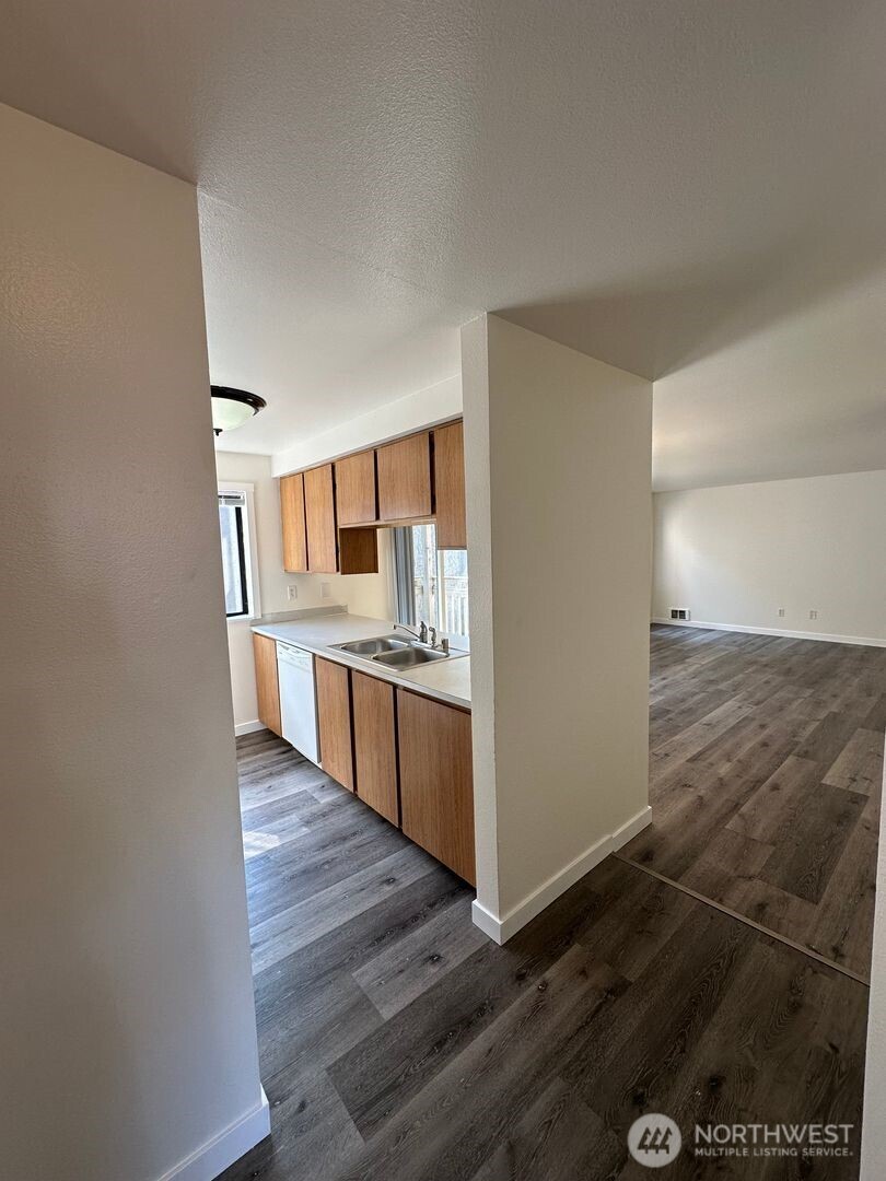 2515 Melvin Avenue, Unit C Everett, WA 98203 - Photo 2 of 13 a large kitchen with granite countertop a large counter top space and stainless steel appliances