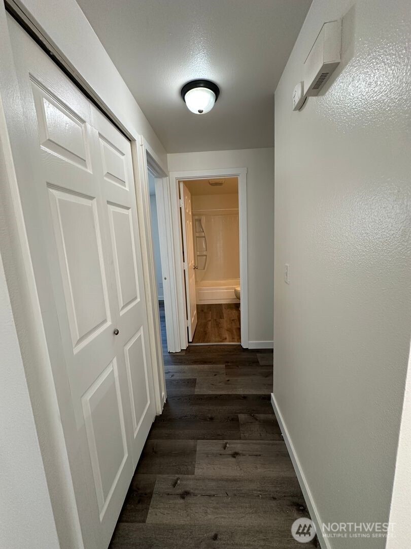 2515 Melvin Avenue, Unit C Everett, WA 98203 - Photo 8 of 13 a view of a hallway with wooden floor and staircase
