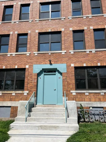 a view of front door of house with stairs