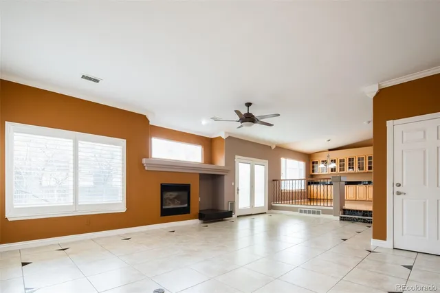 a view of a livingroom with a fireplace and window