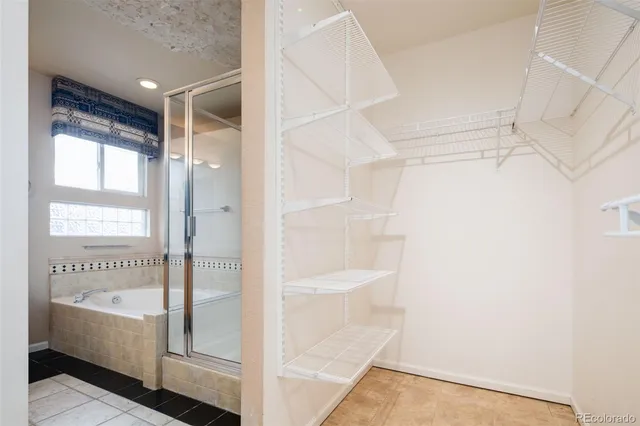 a bathroom with a bathtub and shower